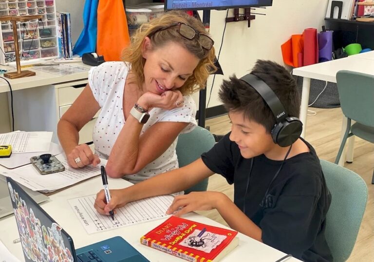 Microschool teacher working with a student