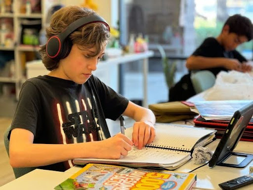 child studying at a microschool